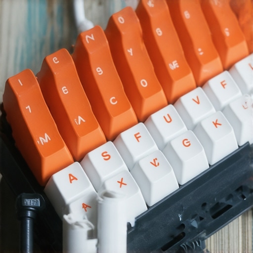 Close-up view of a customizable low profile mechanical keyboard highlighting ergonomic design and switch options.